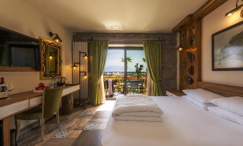 Family Room, Balcony, Sea View | Minibar, in-room safe, desk, soundproofing