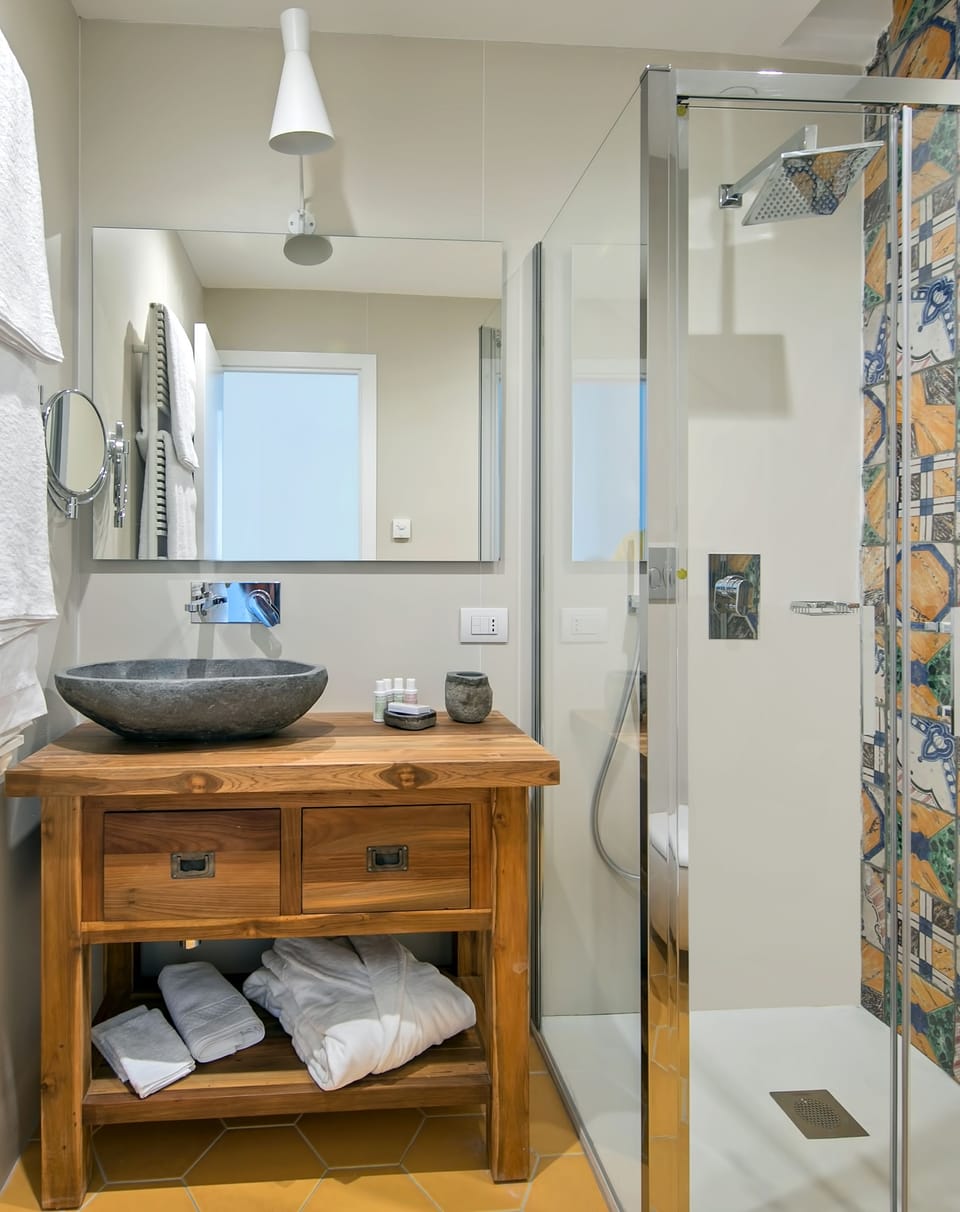 Shower, rainfall showerhead, designer toiletries, hair dryer