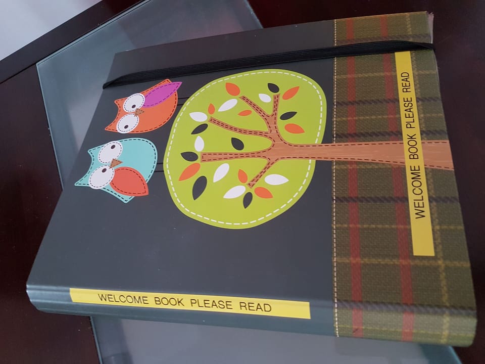 Welcome Book. Lots of info re stores, restaurants & how things work.
