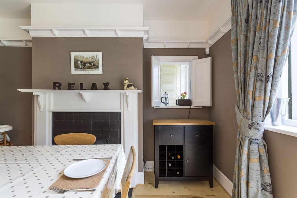 Hatch to the kitchen and French doors to the garden