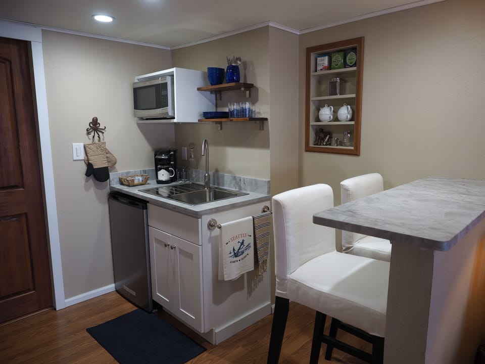 Kitchenette has a microwave & mini fridge. Is complete w/ dishes, flatware, etc.