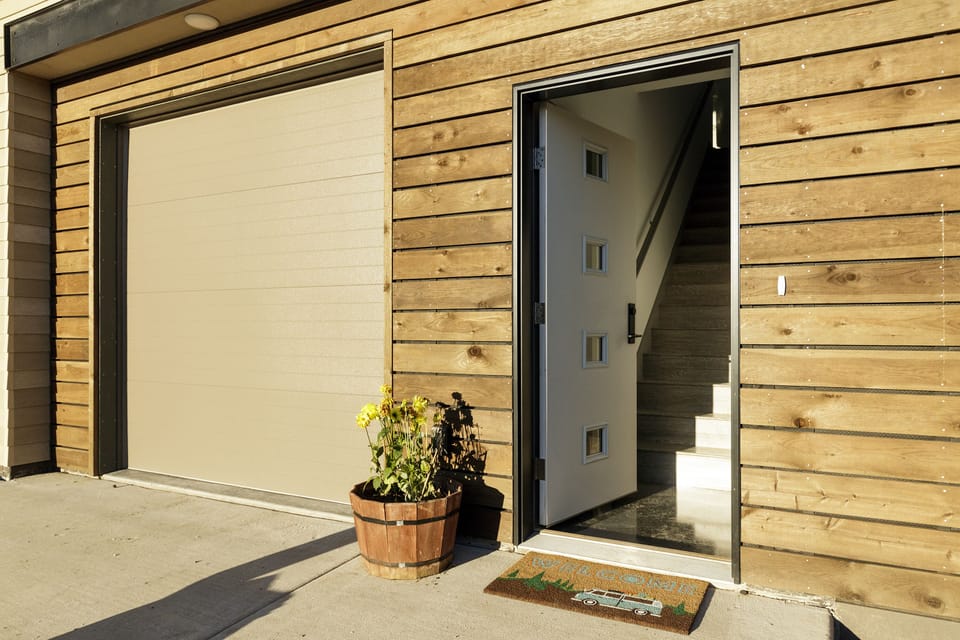 Private entrance next to parking spot with additional parking on street.
