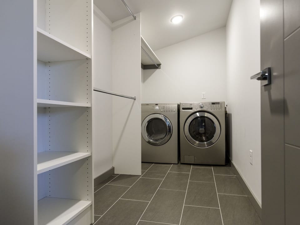 Large walk-in closet with space for unpacking with washer and dryer available.