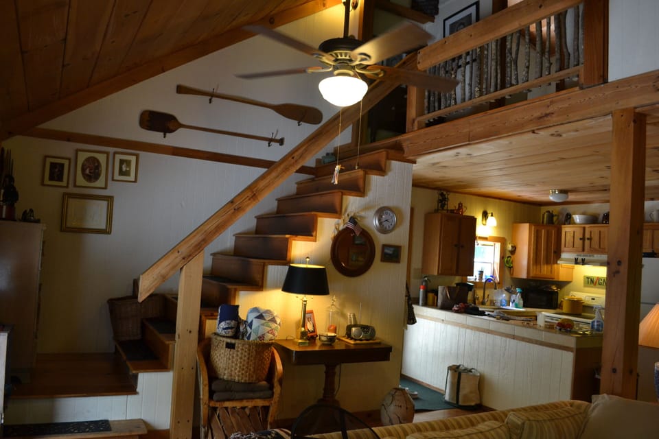 Bed and bath in the loft.  Open floor plan.
