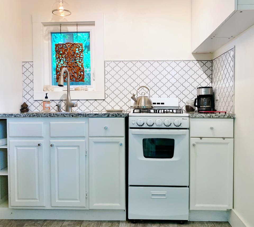 Kitchen has gas range, coffee maker, microwave and full size refrigerator
