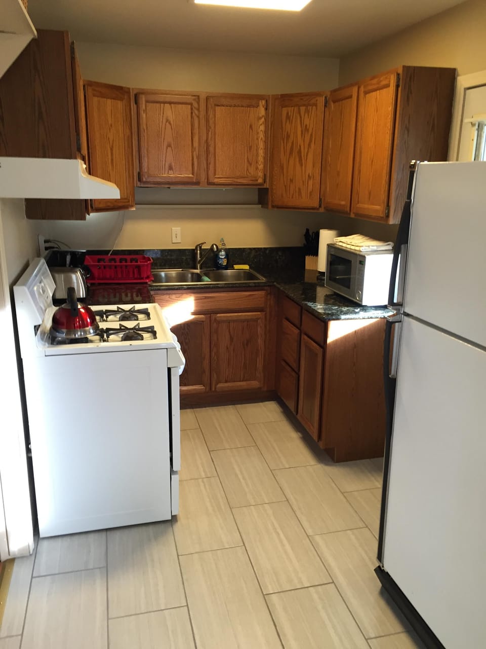 Fully stocked kitchen, with all the pots, pans, dishes etc.