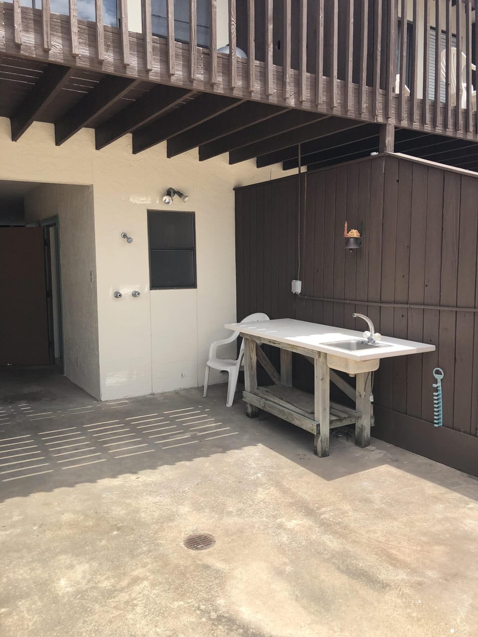 Fish cleaning table and outdoor shower