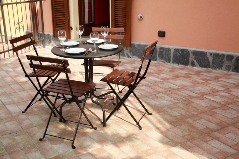 Terrace of our holiday apartment with flat behind