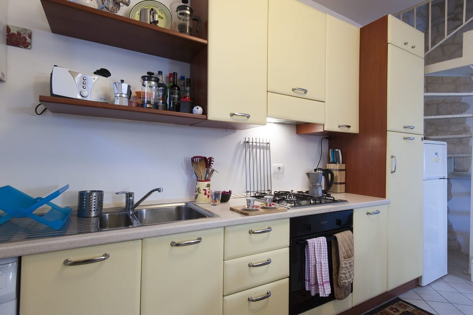 Casa Rosa's fully fitted kitchen, complete with washing machine, very handy
