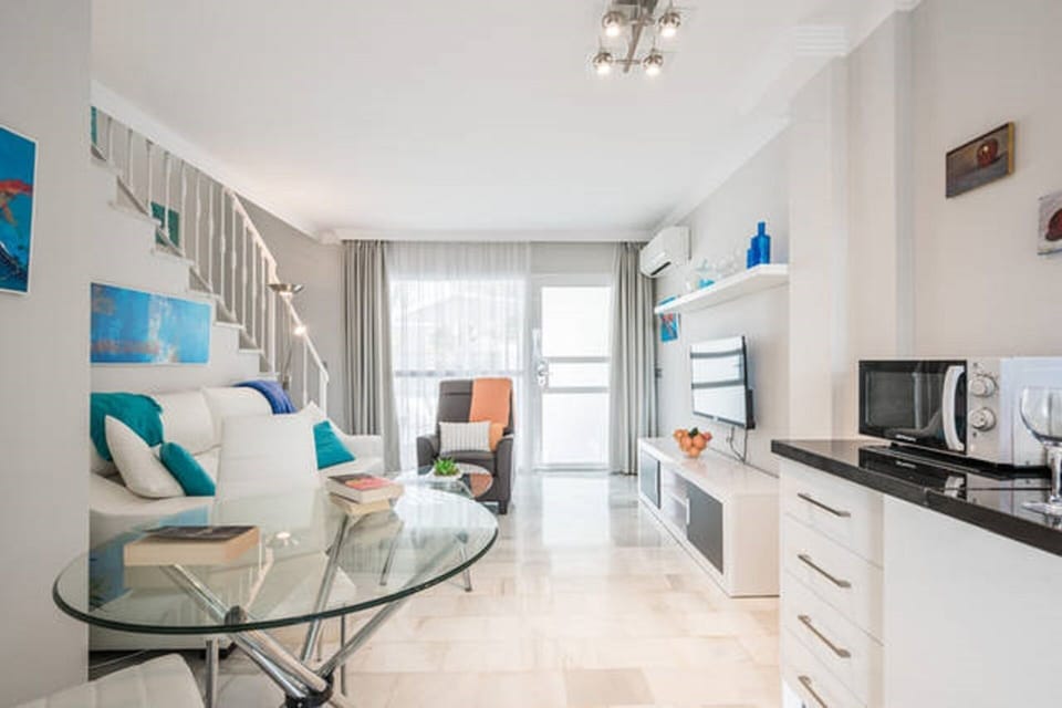 Open plan living area and marble floors