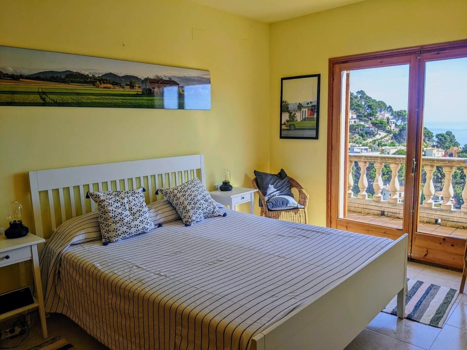 The bright and spacious master bedroom