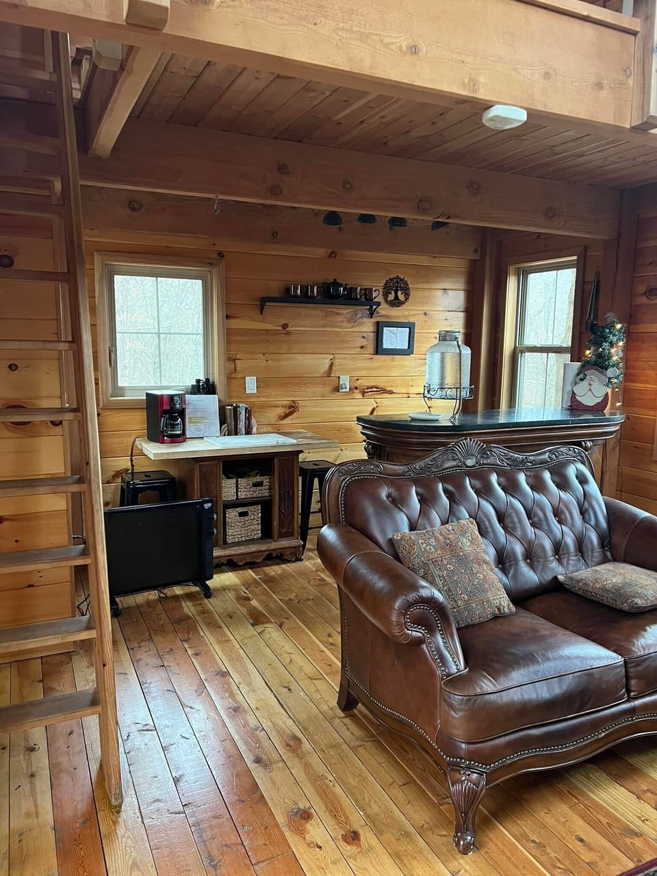 ship ladder to upstairs loft
Kitchenette behind bar with mini fridge and stove