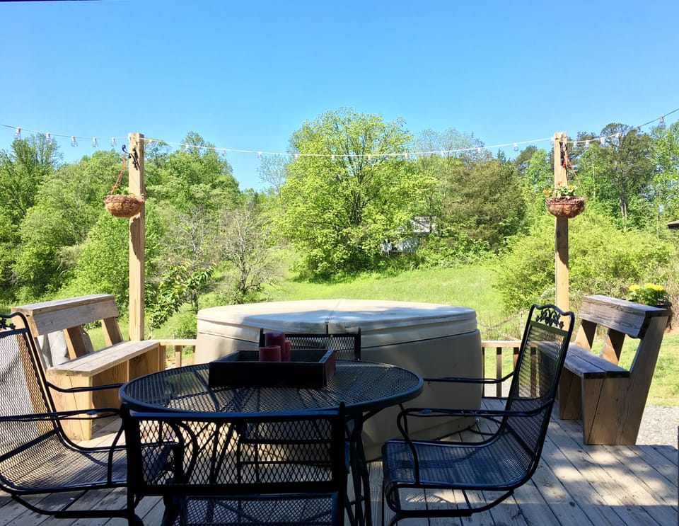 Outdoor table and two person hot tub.