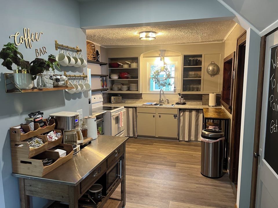 The sweet original 1930 kitchen opens now to the entryway