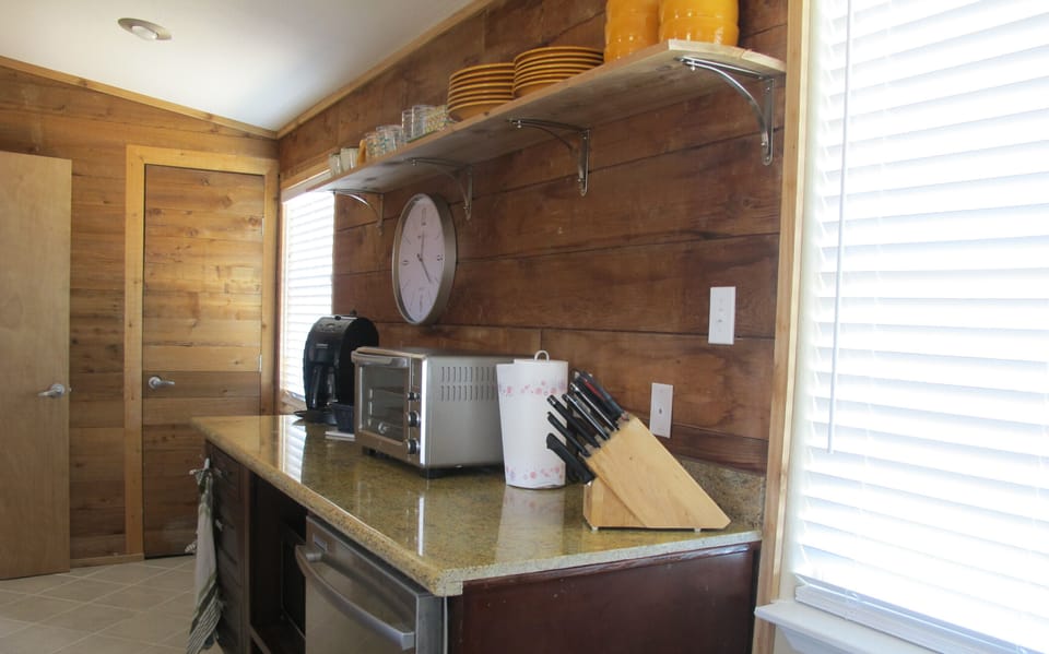 back bar with microwave, large toaster oven, grind and brew coffee maker