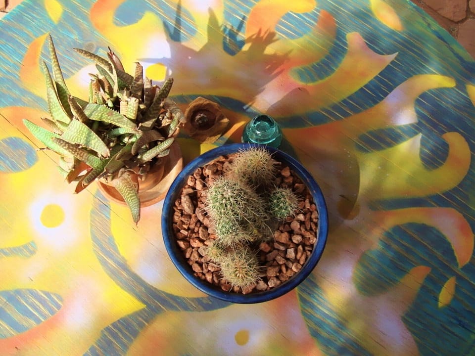 Our patio tabletop says it all about our bright, cozy & eclectic home near Zion!