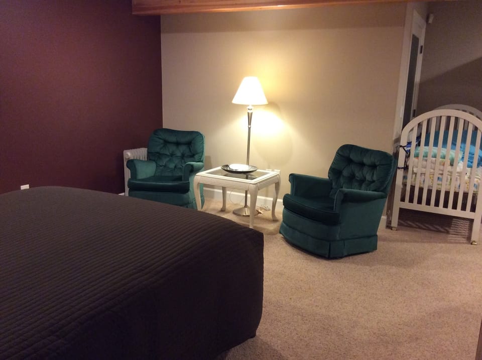 Sitting area and crib in family room area