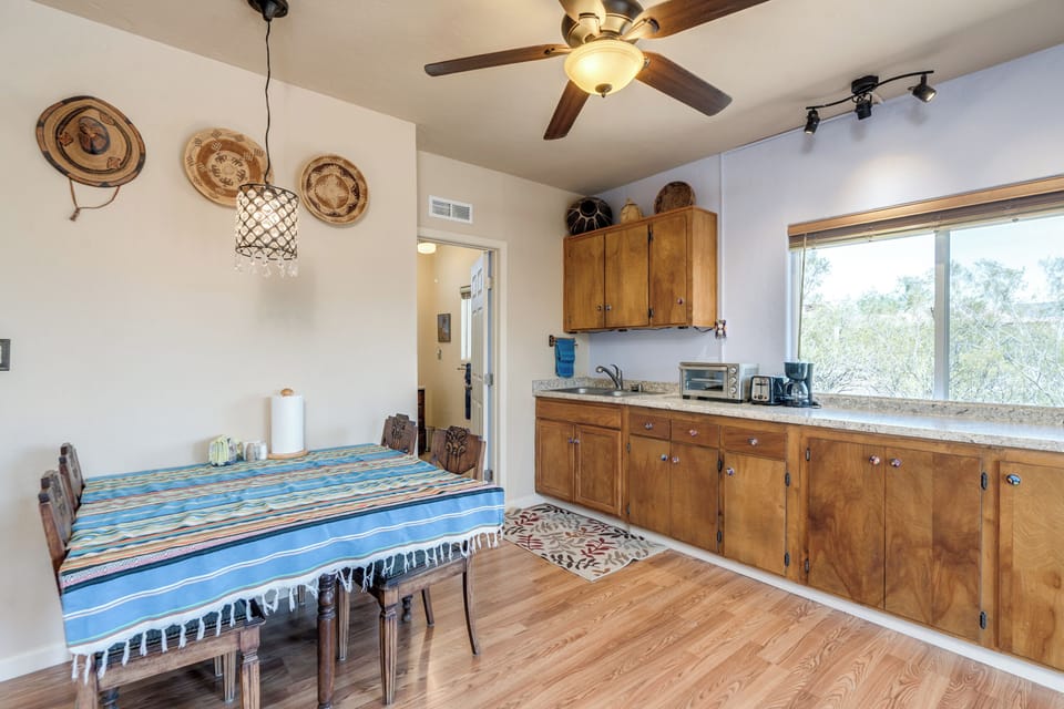 Dining table and kitchen with small appliances 