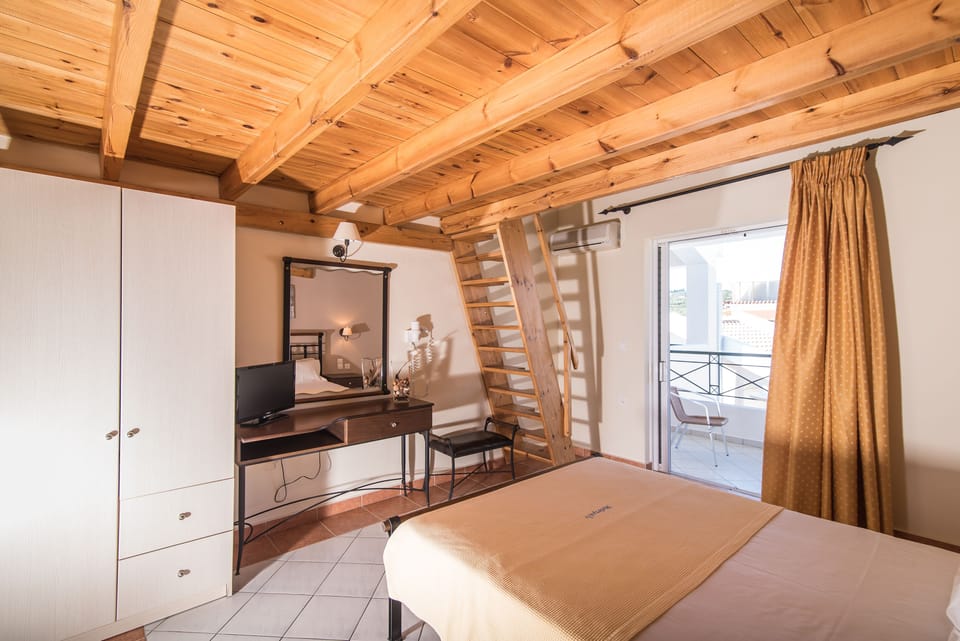 Family Loft, Pool View | In-room safe, individually decorated, individually furnished, desk