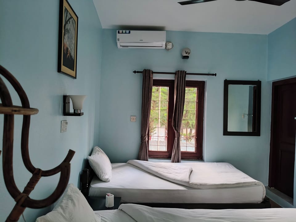 Deluxe Room, Garden View, Garden Area | Desk, laptop workspace, free WiFi, bed sheets