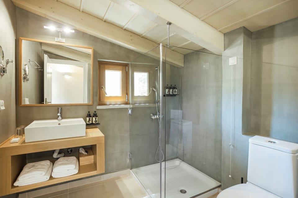 Suite One Bedroom - Silene | Bathroom | Shower, designer toiletries, hair dryer, bathrobes