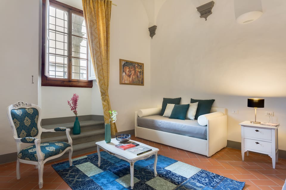 Quadruple Room | Living area | Flat-screen TV