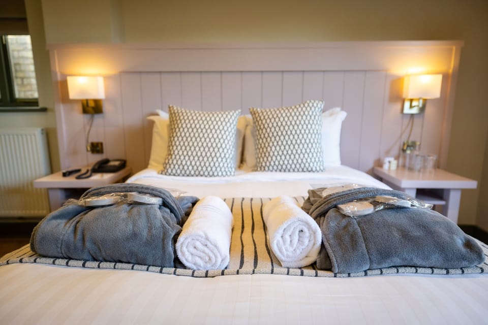 Lincoln Red Hot Tub Room | Premium bedding, down comforters, in-room safe, individually decorated