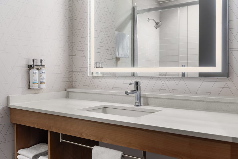 Combined shower/tub, hair dryer, towels, soap