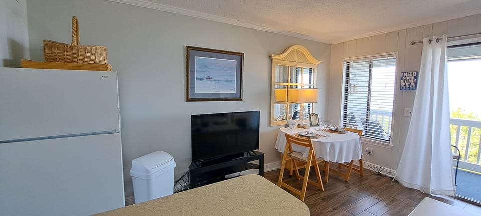Full size fridge /ice maker . Smart TV & dining area.