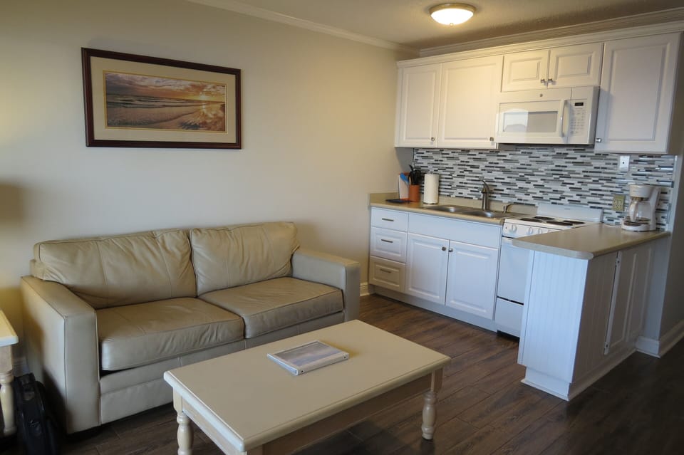 Cozy living area looks out to the water. 
