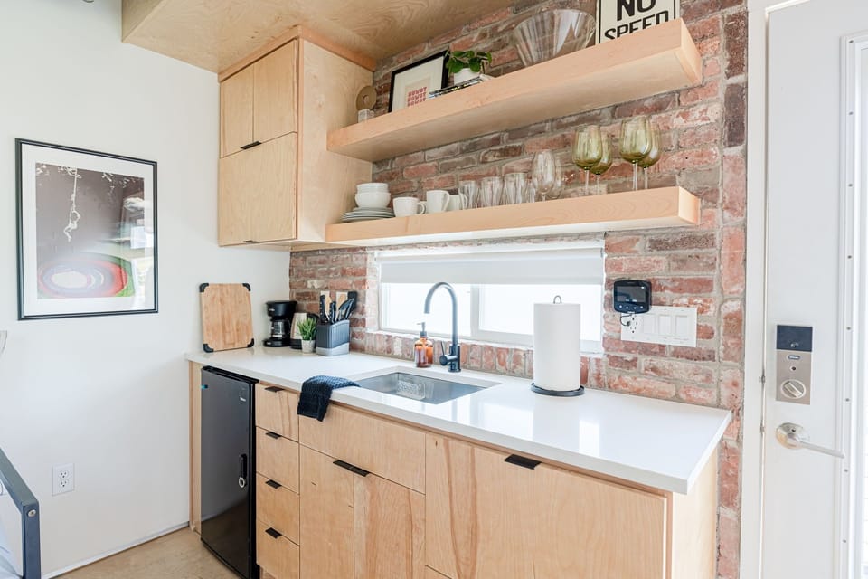 Ample windows let natural light pour in throughout the space.