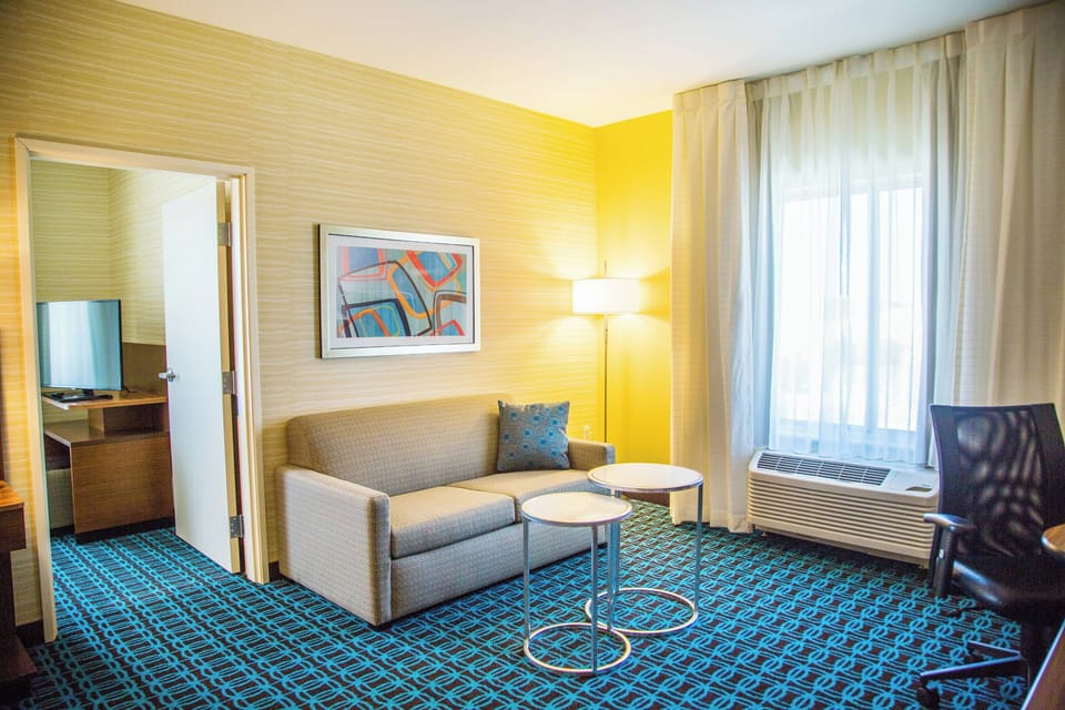 Suite, 1 King Bed | Desk, blackout drapes, iron/ironing board, free cribs/infant beds