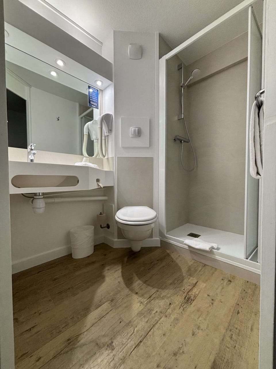 Shower, eco-friendly toiletries, hair dryer, towels