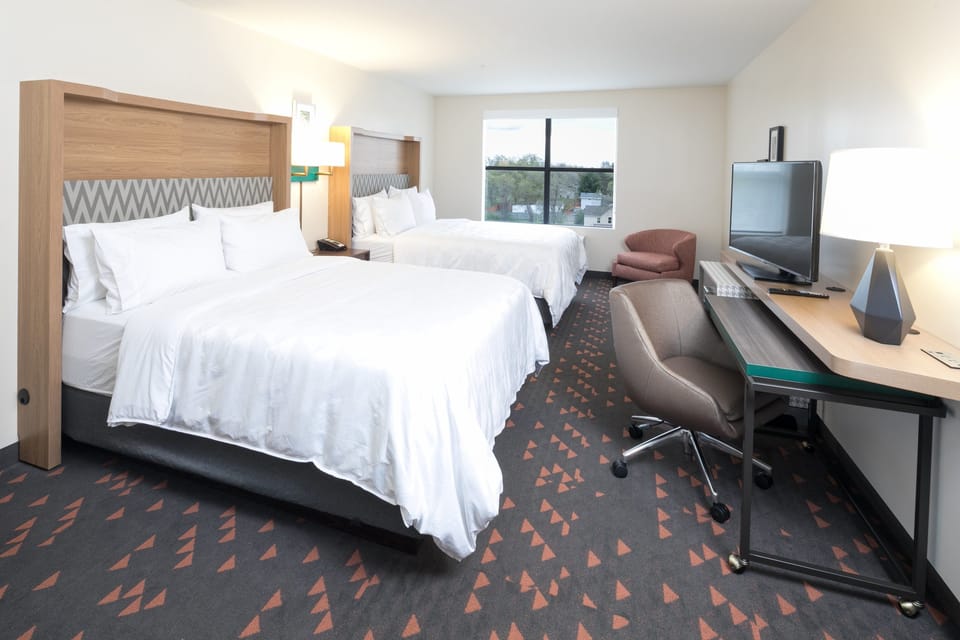 Premium bedding, down comforters, pillowtop beds, in-room safe