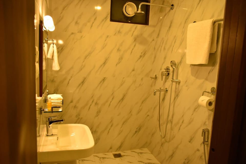 Shower, free toiletries, slippers, towels