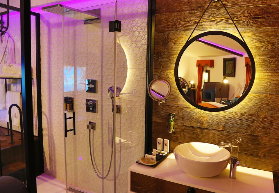 Suite, Jetted Tub | Bathroom | Free toiletries, hair dryer, bathrobes, slippers