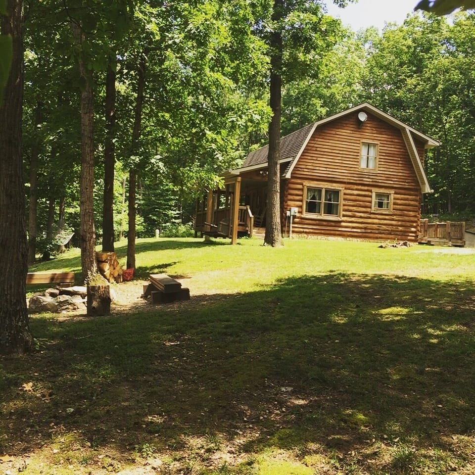 Front yard with fire pit & swing 