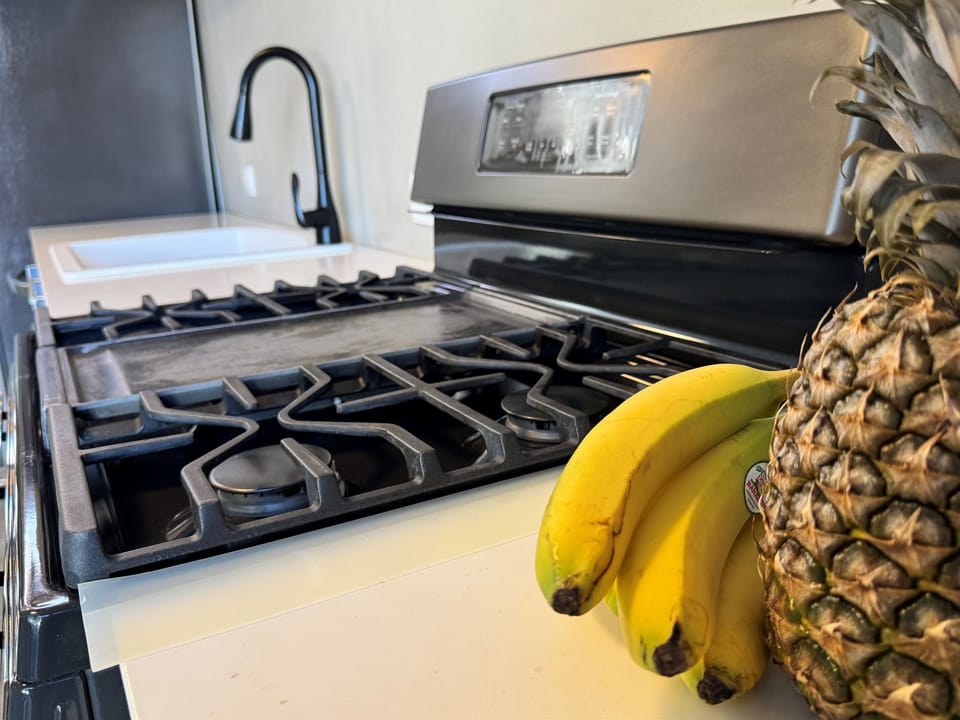 The kitchen features a 5-burner gas stove with a convection oven which makes it easy to prepare anything from a quick breakfast to a delicious island inspired dinner.