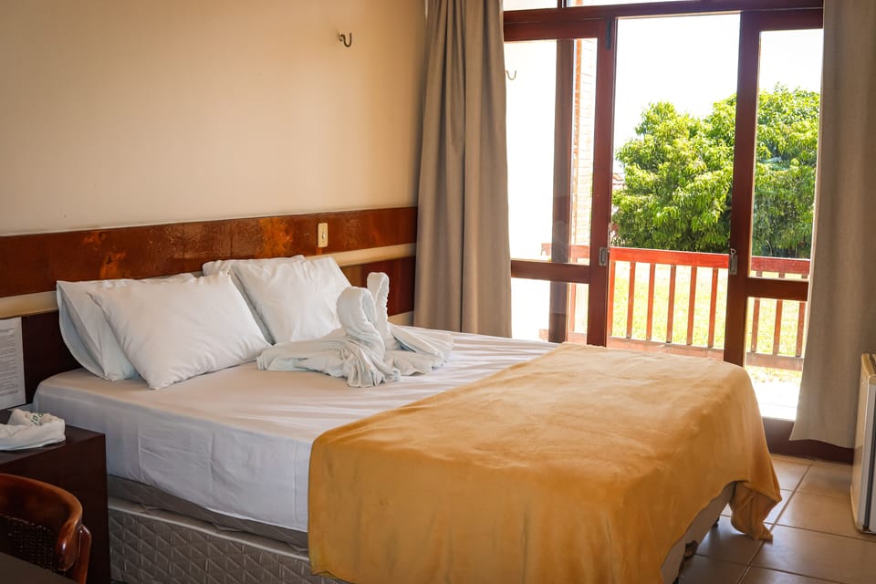Deluxe Suite, Balcony, Garden View | Desk, blackout drapes, free WiFi, bed sheets