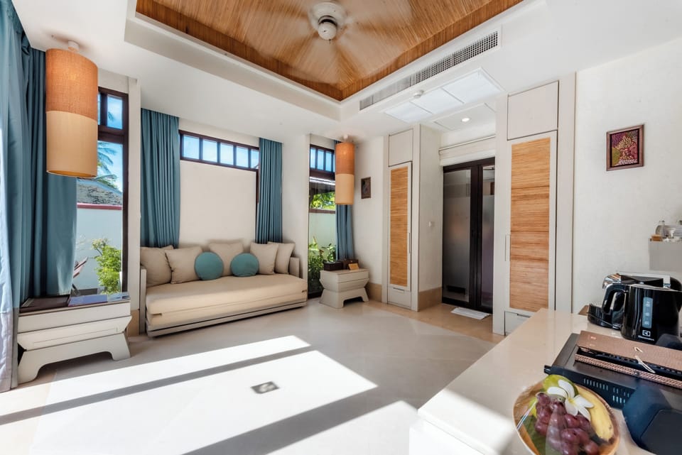 Pool Villa Suite | Living area | 40-inch Smart TV with cable channels