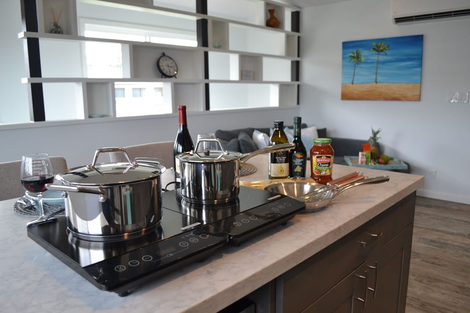Induction hotplates kept in the cabinet until needed.