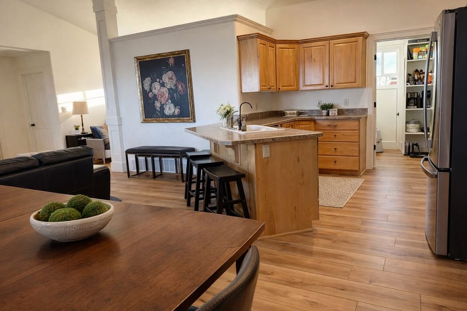 Open kitchen/dining/living area with attached pantry and laundry