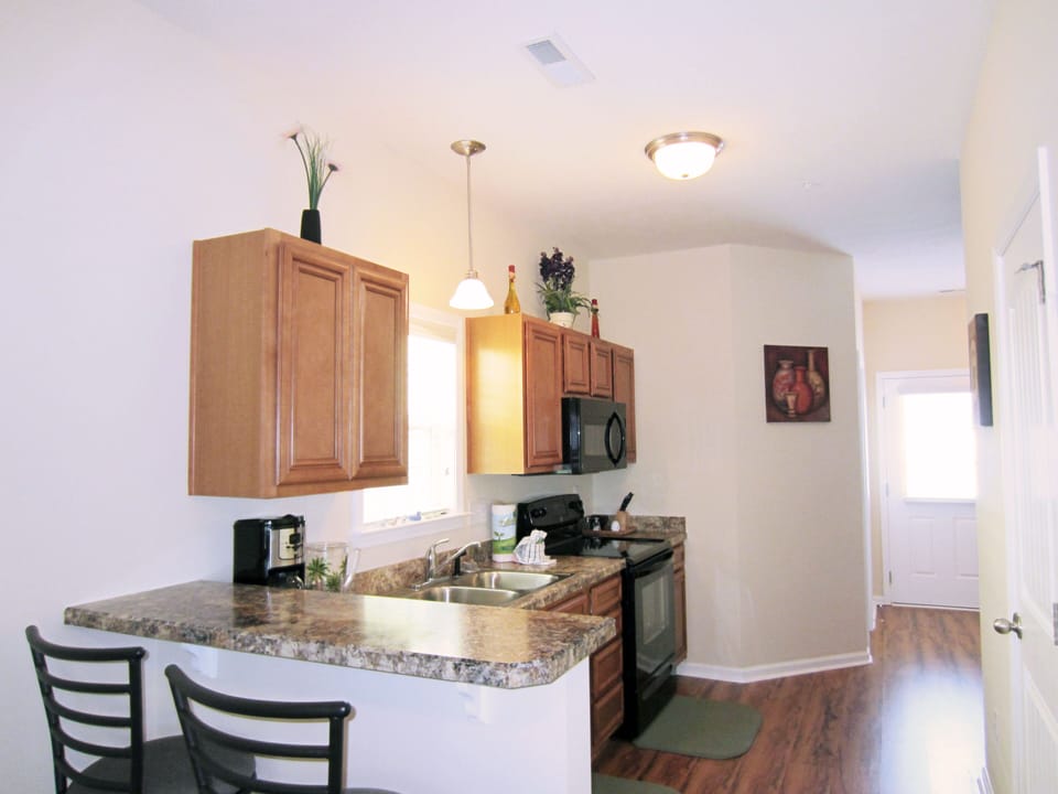 Kitchen with Bar Counter and High Chairs 
