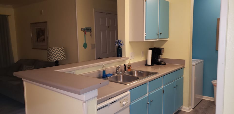 KITCHEN, LIVING ROOM AND DINING ROOM ALL OPEN TO EACH OTHER