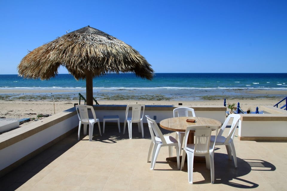 Sit on the patio with a cold drink in your hand.