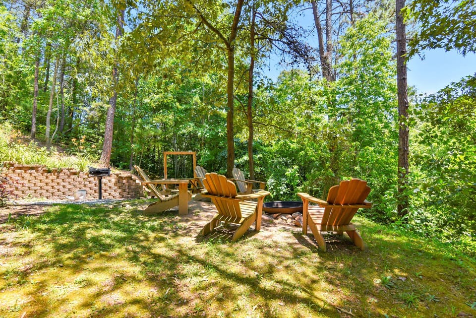 Our outdoor fire pit area w/ charcoal grill & swing nearby.