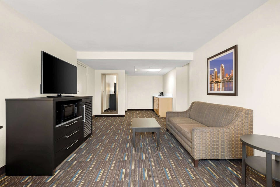 Desk, laptop workspace, blackout drapes, iron/ironing board