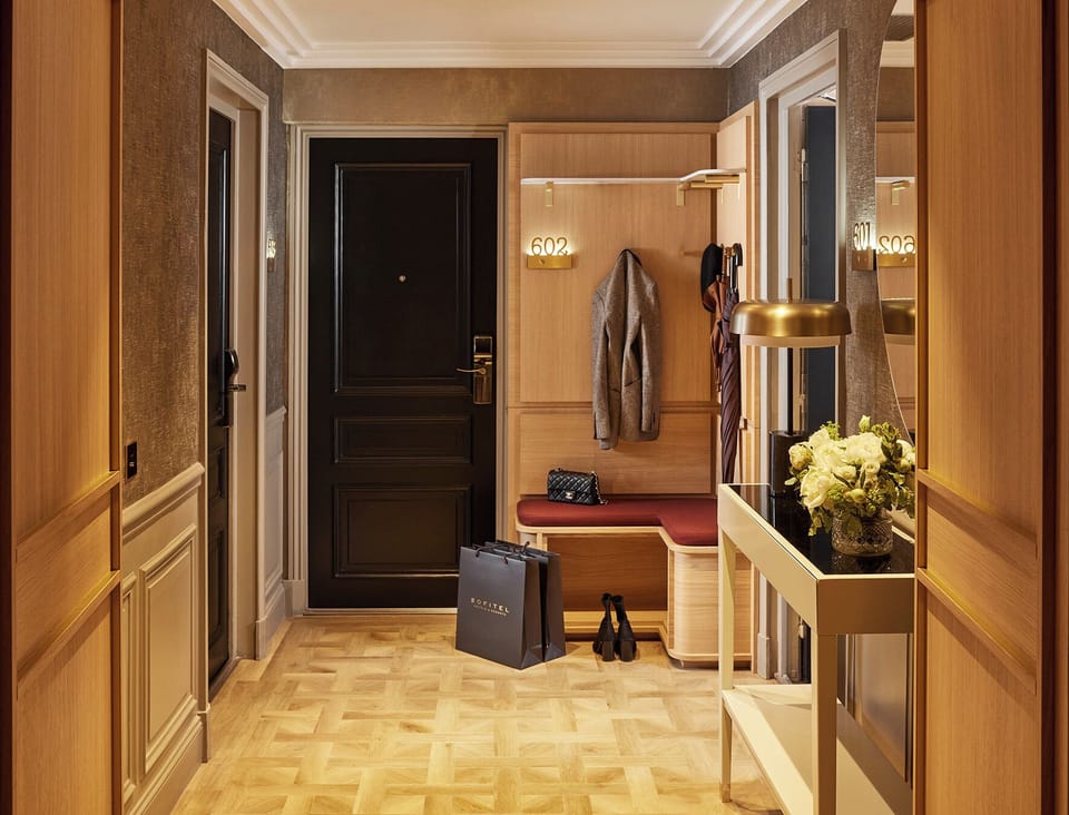 Eiffel Family Suite | Living area | 46-inch flat-screen TV with satellite channels, TV, iPod dock