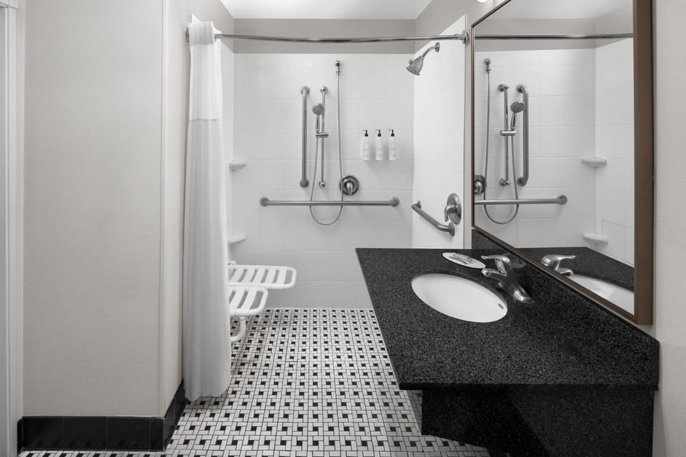 Bathtub, hair dryer, towels