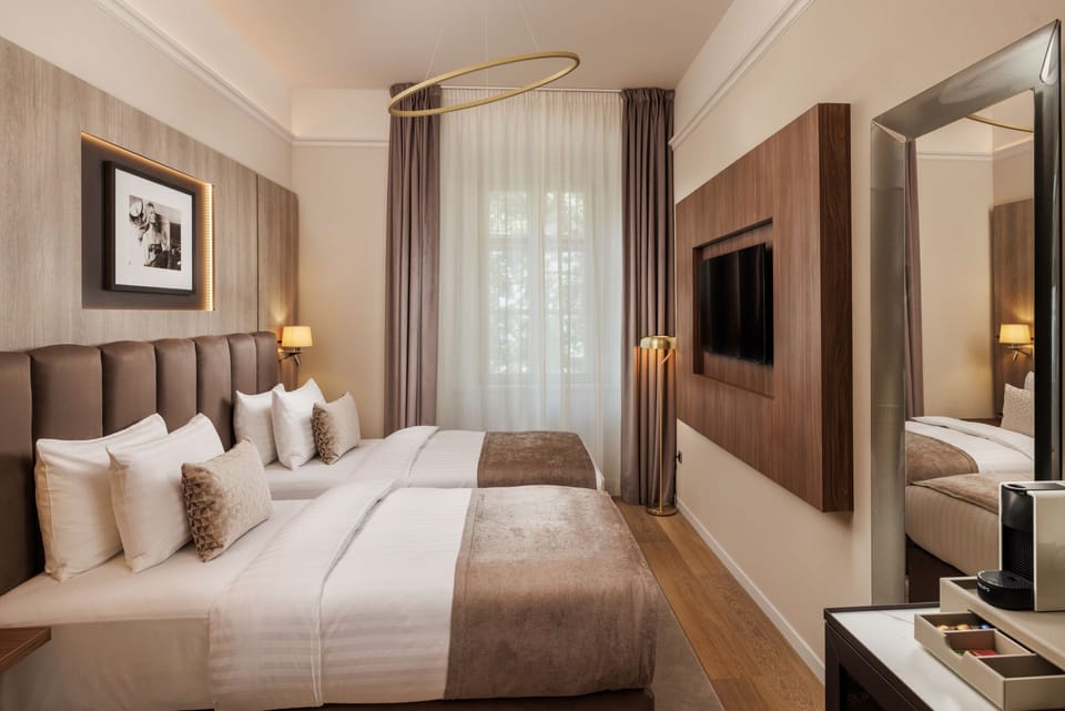 Superior Double or Twin Room | Minibar, in-room safe, desk, laptop workspace